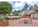 Community pool area with outdoor seating, brick patio, and barbecue at 6851 Roswell Rd # E4, Atlanta, GA 30328