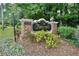 Foxcroft community sign on a brick base surrounded by landscaping at 6851 Roswell Rd # E4, Atlanta, GA 30328