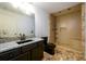 Bathroom with updated granite countertop, sink, toilet and shower at 1045 Paper Creek Dr, Lawrenceville, GA 30046