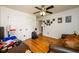 Spacious bedroom with hardwood floors, ceiling fan, and ample closet space at 1045 Paper Creek Dr, Lawrenceville, GA 30046