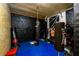 Basement boxing room featuring punching bag, training equipment and padded floor at 1045 Paper Creek Dr, Lawrenceville, GA 30046