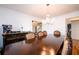 Spacious dining room featuring hardwood floors, a chandelier, and elegant furniture at 1045 Paper Creek Dr, Lawrenceville, GA 30046