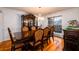 Formal dining room featuring hardwood floors, a chandelier, and a large window at 1045 Paper Creek Dr, Lawrenceville, GA 30046