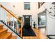 Inviting foyer with hardwood floors, staircase, and high ceilings at 1045 Paper Creek Dr, Lawrenceville, GA 30046