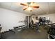 Spacious home gym with exercise equipment and ceiling fan at 1045 Paper Creek Dr, Lawrenceville, GA 30046