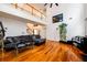 Spacious living room with high ceilings, hardwood floors, and a staircase leading to an upper level at 1045 Paper Creek Dr, Lawrenceville, GA 30046