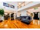 Bright living room with hardwood floors, high ceilings, and a staircase leading to the upper level at 1045 Paper Creek Dr, Lawrenceville, GA 30046