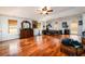 A generous main bedroom features hardwood floors, with a tray ceiling, and ample space for relaxation at 1045 Paper Creek Dr, Lawrenceville, GA 30046