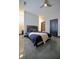 Cozy bedroom with stylish grey doors, polished floors, and modern ceiling fan at 1195 Milton Se Ter # 1109, Atlanta, GA 30315