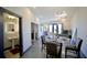 Dining room with modern light fixture, seating for four, and view to the bathroom and living space at 1195 Milton Se Ter # 1109, Atlanta, GA 30315