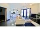 Open concept living room featuring a modern kitchen and access to a balcony with lots of natural light at 1195 Milton Se Ter # 1109, Atlanta, GA 30315