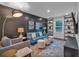 Stylish living room featuring a blue sofa, modern decor, and shelving at 135 Old Alabama Rd, Emerson, GA 30137