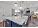 Spacious living area flows to the kitchen, complemented by an island with bar seating at 135 Old Alabama Rd, Emerson, GA 30137