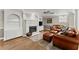 Finished basement with decorative fireplace and leather furniture at 4223 N Mountain Ne Rd, Marietta, GA 30066