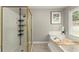 Bathroom featuring tub, shower, and window with natural light at 4223 N Mountain Ne Rd, Marietta, GA 30066