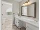 Bathroom with double sinks, stylish mirrors, and modern lighting at 4223 N Mountain Ne Rd, Marietta, GA 30066
