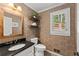 Cozy half bathroom with a modern vanity, floating shelves and a window view at 4223 N Mountain Ne Rd, Marietta, GA 30066