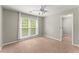 Neutral bedroom with carpet, bright window, and a connected door at 4223 N Mountain Ne Rd, Marietta, GA 30066