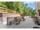 Spacious deck features multiple seating areas and overlooks a private, wooded backyard at 4223 N Mountain Ne Rd, Marietta, GA 30066
