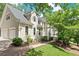 Elegant home with a charming stucco exterior, complemented by an attached two-car garage and verdant lawn at 4223 N Mountain Ne Rd, Marietta, GA 30066