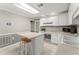 Bright kitchen with white cabinets, modern appliances, and an island with seating at 4223 N Mountain Ne Rd, Marietta, GA 30066