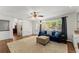 Inviting living room with hardwood floors, natural light, a cozy seating area, and built-in shelving at 4223 N Mountain Ne Rd, Marietta, GA 30066