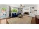 Bright living room with a fireplace, built-in shelves, hardwood floors and access to the backyard at 4223 N Mountain Ne Rd, Marietta, GA 30066