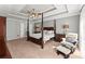 Spacious bedroom features a tray ceiling, ceiling fan, and natural light at 4223 N Mountain Ne Rd, Marietta, GA 30066