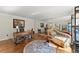 Sunlit office with hardwood floors, mirrored closet doors, stylish desk, and comfortable seating area at 4223 N Mountain Ne Rd, Marietta, GA 30066