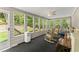 An enclosed sunroom with many windows to view the backyard at 4223 N Mountain Ne Rd, Marietta, GA 30066