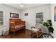 Cozy bedroom featuring hardwood floors, a rocking chair, and a baby crib at 1790 Shirley Sw St, Atlanta, GA 30310