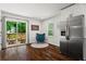 Cozy breakfast area with stainless steel refrigerator and sliding glass door to the deck at 1790 Shirley Sw St, Atlanta, GA 30310