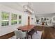 Spacious dining room open to living room with hardwood floors and ample natural light at 1790 Shirley Sw St, Atlanta, GA 30310