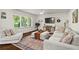 Bright living room features an area rug, comfortable seating, and lots of natural light at 1790 Shirley Sw St, Atlanta, GA 30310