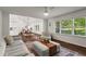 Bright and open-concept living room featuring hardwood floors and natural light at 1790 Shirley Sw St, Atlanta, GA 30310