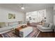 Open-concept layout with a living room that flows into a modern kitchen and dining area at 1790 Shirley Sw St, Atlanta, GA 30310