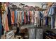 Walk-in closet with ample storage shelves and hanging areas for clothes at 1790 Shirley Sw St, Atlanta, GA 30310