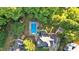 Picturesque aerial view of the home showcasing the pool, firepit, and surrounding lush greenery at 185 Waverly Walk, Douglasville, GA 30134