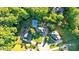 Stunning aerial perspective of the property surrounded by lush trees in a desirable residential neighborhood at 185 Waverly Walk, Douglasville, GA 30134