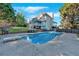 Spacious backyard with swimming pool, patio, and well-maintained landscaping at 185 Waverly Walk, Douglasville, GA 30134