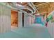 Unique basement area featuring colorful decor, exposed ductwork, and painted floor at 185 Waverly Walk, Douglasville, GA 30134