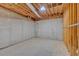 Unfinished basement with concrete walls, exposed ceiling, studs and plumbing at 185 Waverly Walk, Douglasville, GA 30134