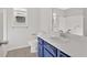 Bathroom with blue vanity, white countertop, and tile flooring at 185 Waverly Walk, Douglasville, GA 30134