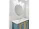 Bathroom vanity features white marble countertop, an oval mirror, and stylish lighting at 185 Waverly Walk, Douglasville, GA 30134