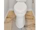Close up of toilet room boasting a toilet and marble flooring at 185 Waverly Walk, Douglasville, GA 30134