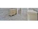 Well-lit bathroom featuring marble floors, dual vanities, and decorative wall tiling and accents at 185 Waverly Walk, Douglasville, GA 30134