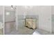 Elegant bathroom features marble floors, a stylish vanity, and decorative wall tiling and accents at 185 Waverly Walk, Douglasville, GA 30134