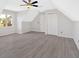 Bedroom with dormer and vaulted ceiling features updated floors and a ceiling fan at 185 Waverly Walk, Douglasville, GA 30134