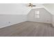 Bedroom features vaulted ceilings, neutral paint, and hardwood floors at 185 Waverly Walk, Douglasville, GA 30134