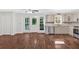 Eat-in kitchen with stainless steel appliances, granite countertops, and access to the deck through glass doors at 185 Waverly Walk, Douglasville, GA 30134